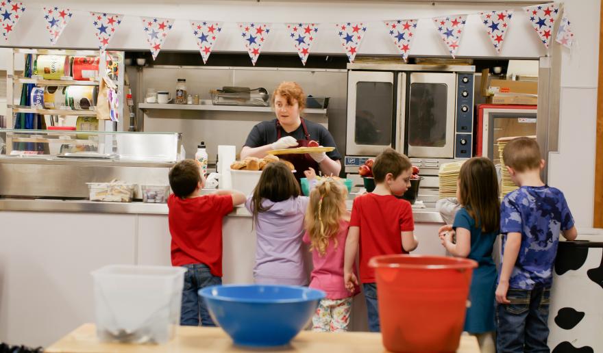 Students in the Boistfort School District stand in line to get a meal in the school cafeteria.