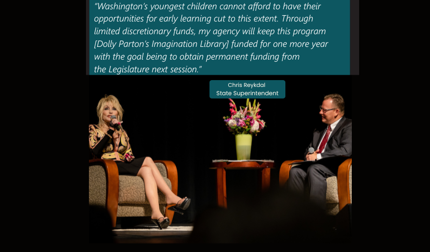 Dolly Parton and the Superintendent having a conversation sitting on stage