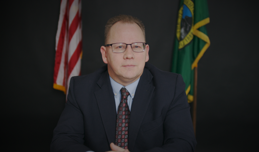 Superintendent Reykdal sitting at a desk