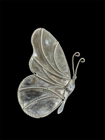 A detailed silver butterfly brooch