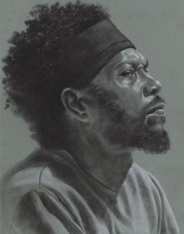  The grayscale drawing features the side profile of a person with curly hair, beard, and a headband on and wearing a shirt.
