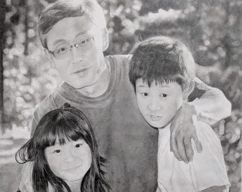 A charcoal pencil drawing of a father with his arms around his young daughter and son. 