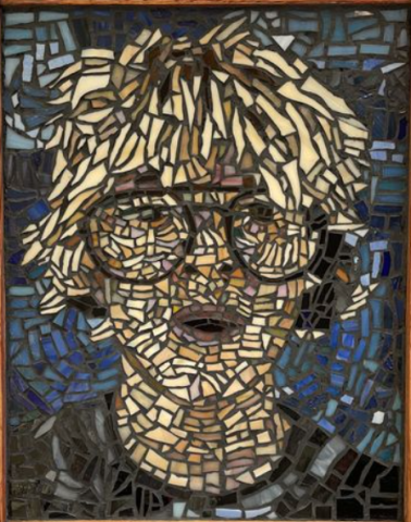 A stained glass mosaic of the artist, an up close image of a young boy's face, wearing glasses with blond hair 