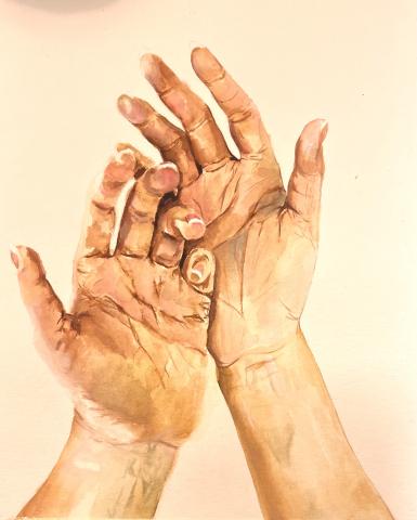 The image "A Work in Progress" depicts an artist's hands palms up while they decide what to create. The background is blank, so the focus is on the artist themself.