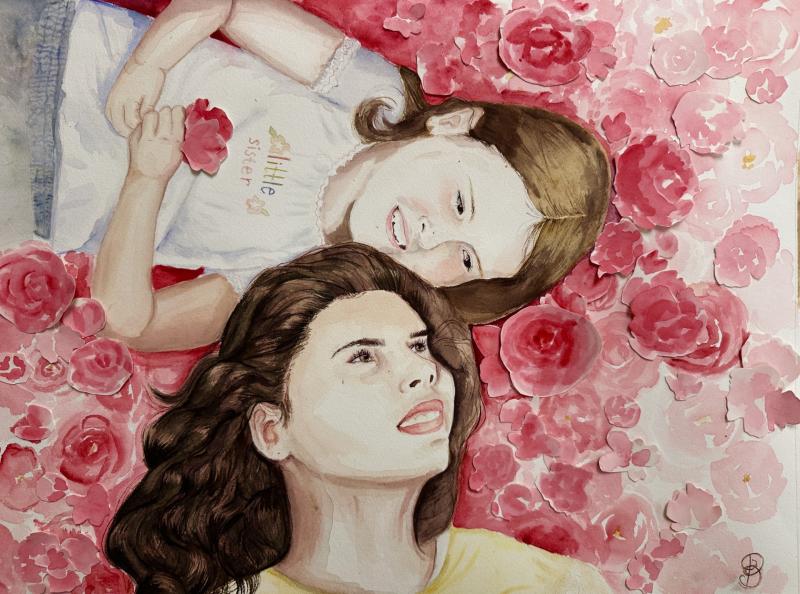 Two children lying on a bed of pink roses, one child holding a rose and the other child resting their head on the first child's shoulder.