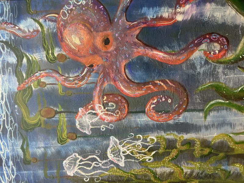 A vibrant underwater scene featuring a large, colorful octopus with swirling tentacles. The octopus is surrounded by green seaweed and several translucent jellyfish floating nearby. The background consists of various shades of blue, giving the impression of deep ocean water. 