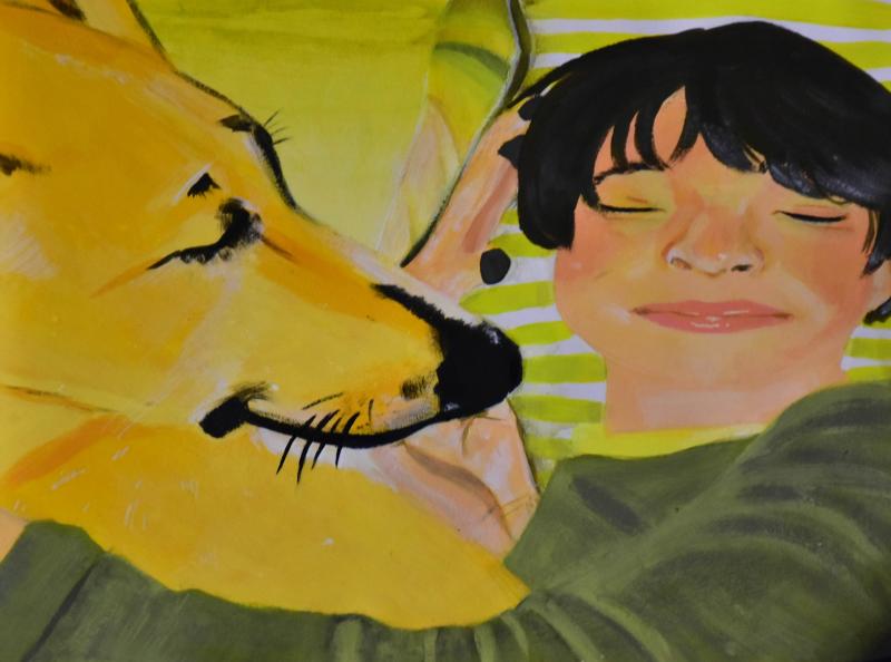 A close up portrayal of a boy and dog laying next to each other smiling