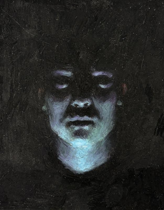 This is a self portrait, lit by blue light from below the face, has a contrasting stark, black background. The subject looks at the audience with a look of horror.