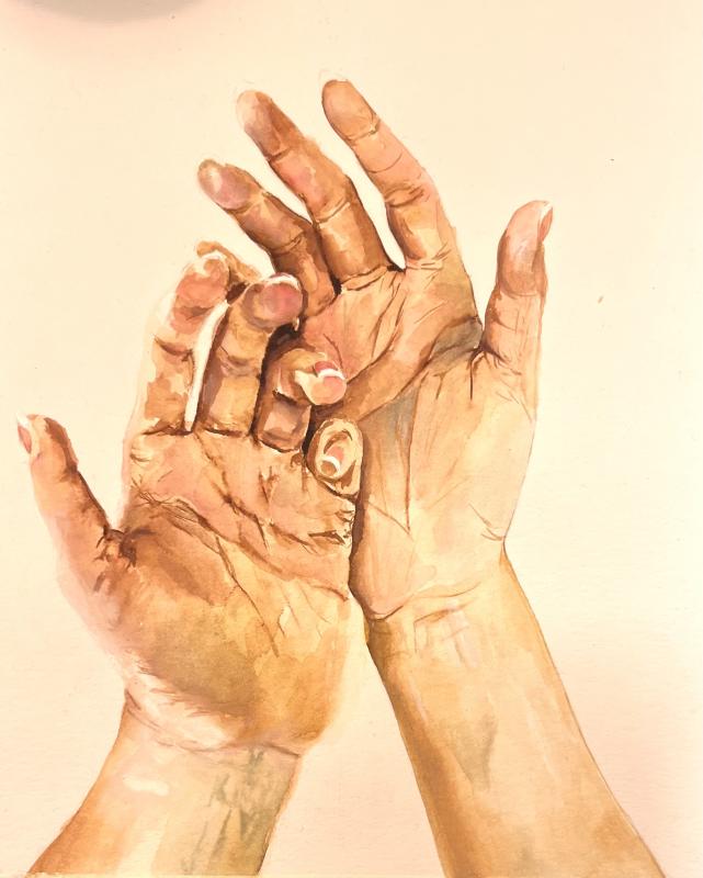 The image "A Work in Progress" depicts an artist's hands palms up while they decide what to create. The background is blank, so the focus is on the artist themself.
