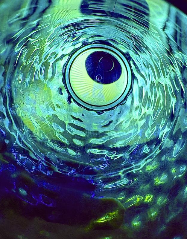 Blue and Green Translucent is a photo of a colorful glass cup with a strong light.
