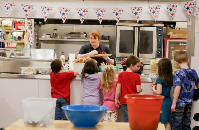 Students in the Boistfort School District stand in line to get a meal in the school cafeteria.