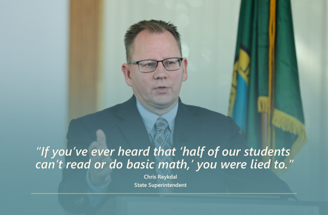 Superintendent Reykdal behind a podium