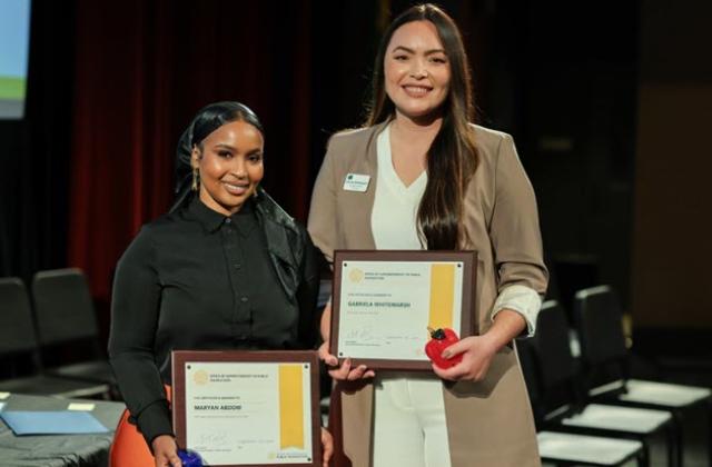 Gabriela Whitemarsh Named 2026 State Teacher of the Year and Maryan Abdow Named 2025 Classified School Employee of the Year holding awards