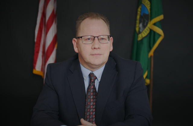 Superintendent Reykdal sitting at a desk